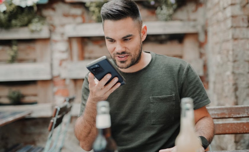 Man using voice assistance on a mobie phone