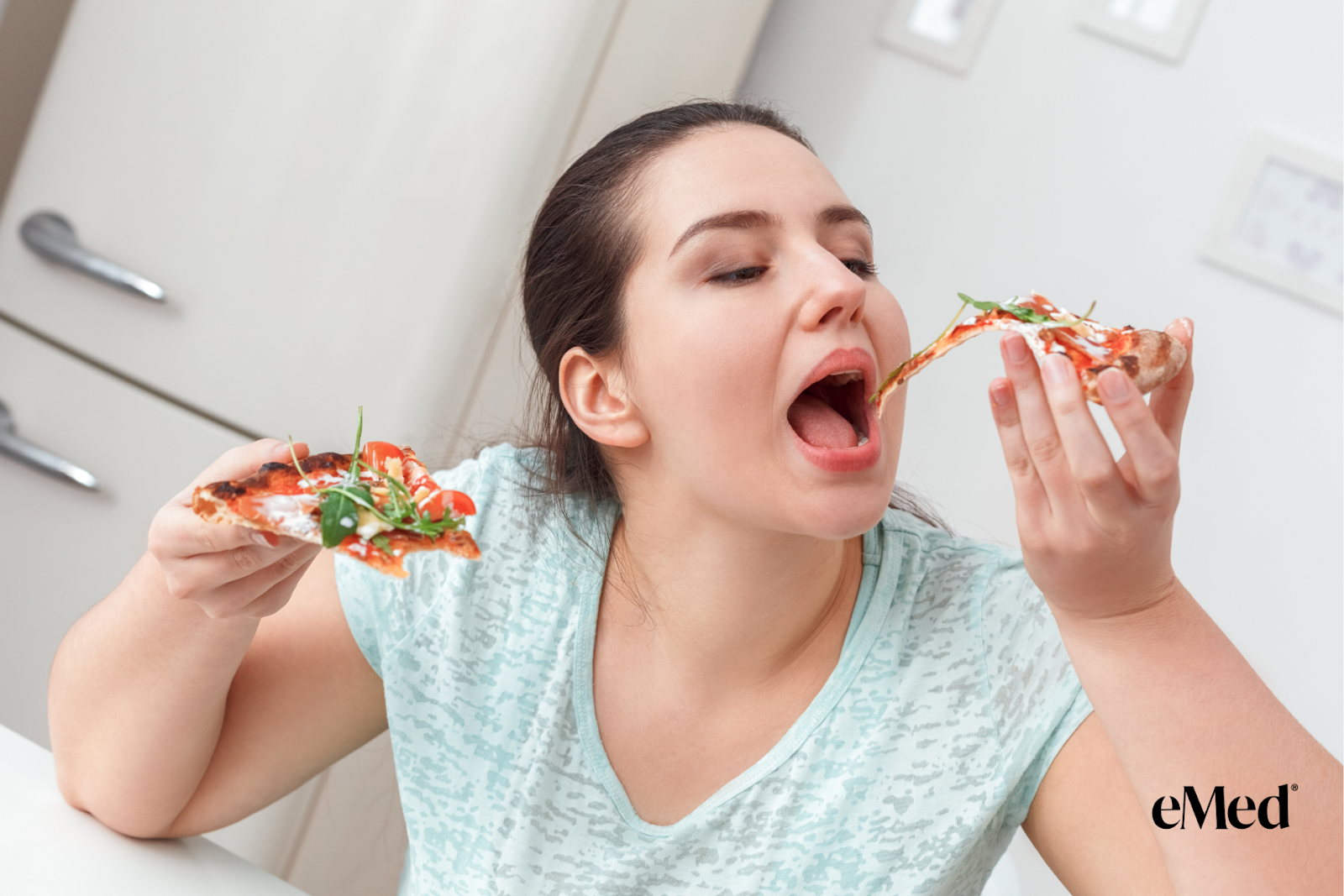 A female binge eating pizza.