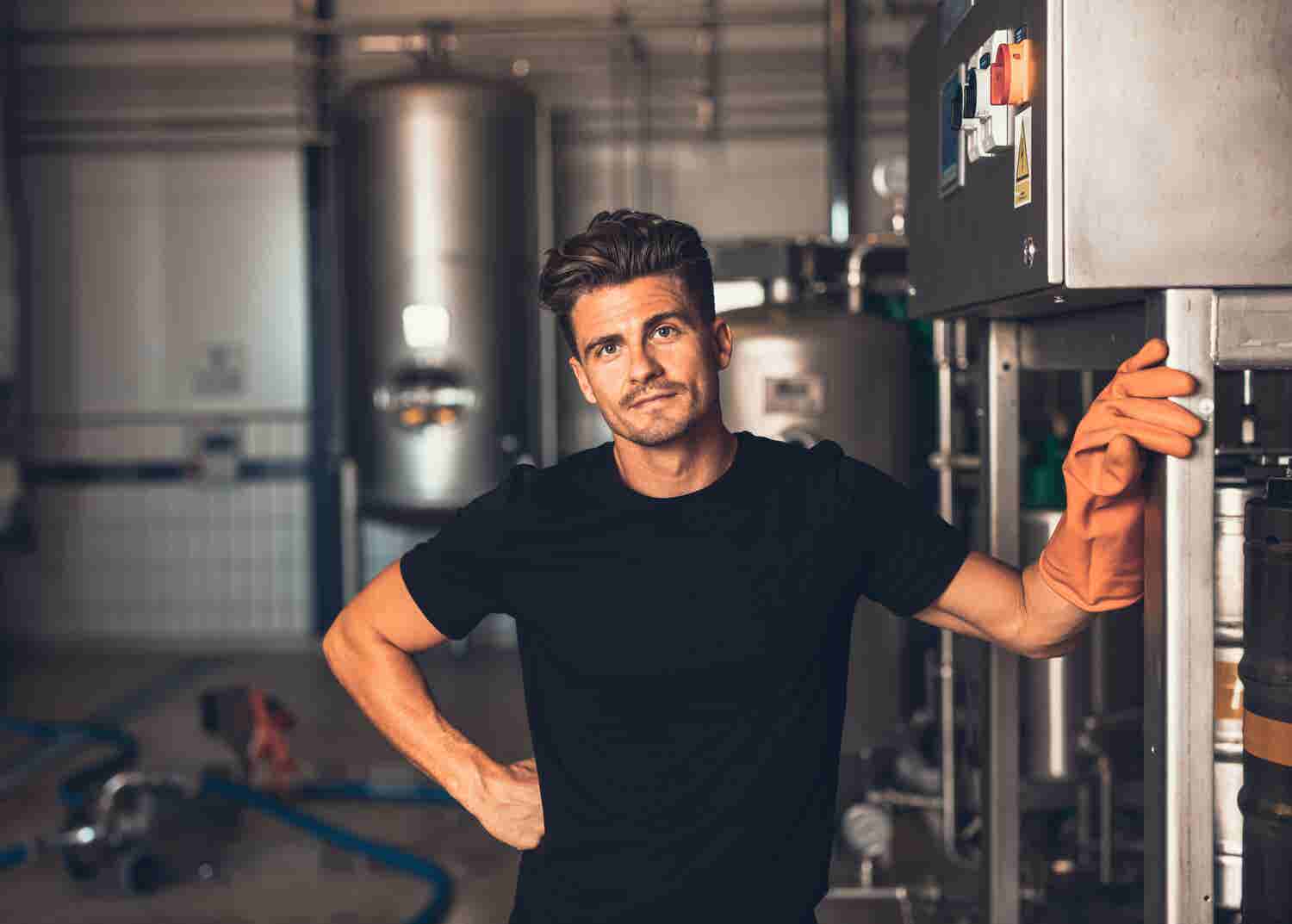 Man standing in front of metal equipment