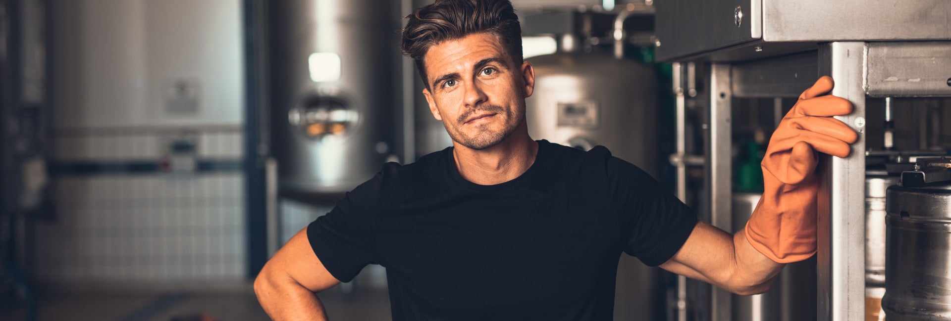 Man standing in front of metal equipment