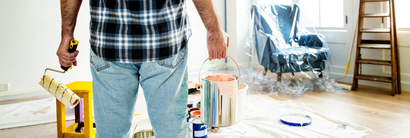 Man holding paint can