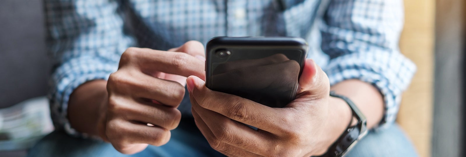 Man browses digital banking on his phone