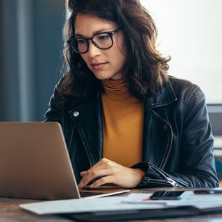 Woman looking at laptop