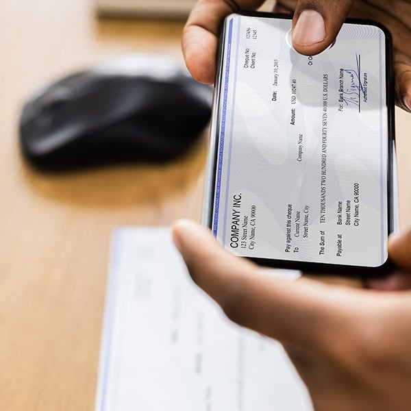 Business owner makes mobile check deposit