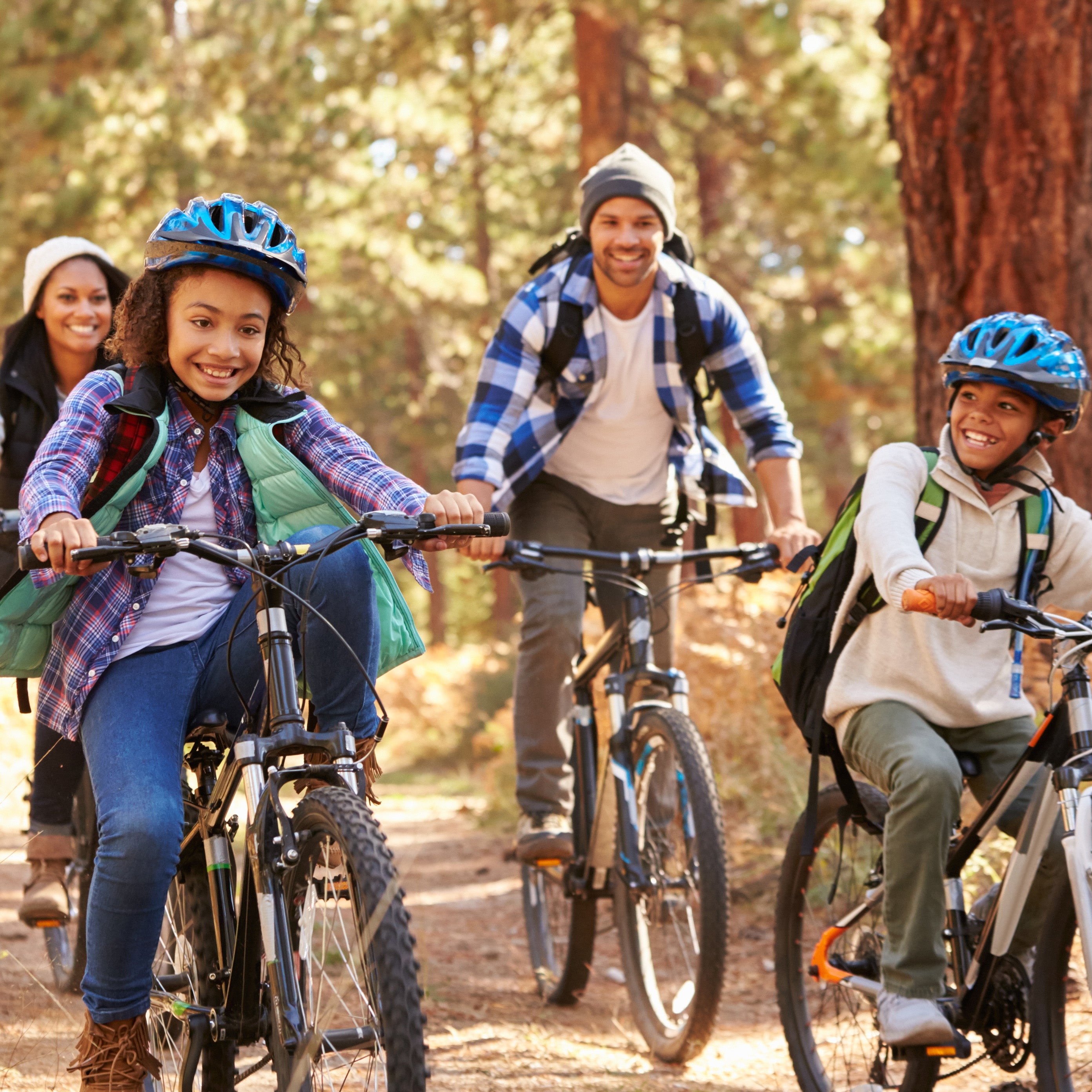 Family rides bikes together