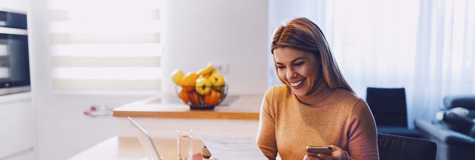 Woman looking at statement smiling