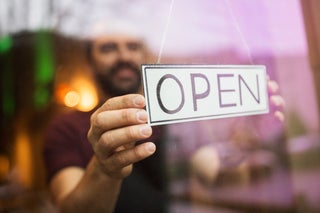 Man Flips Open Sign