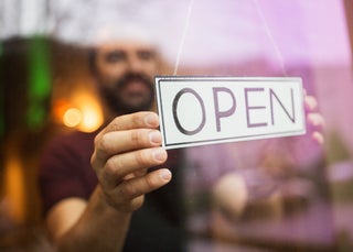 Man Flips Open Sign