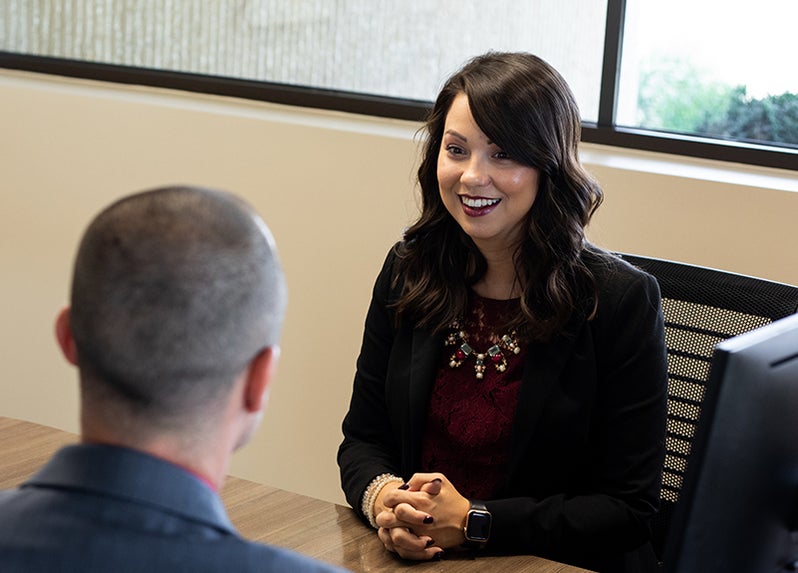 Employee smiles in meeting