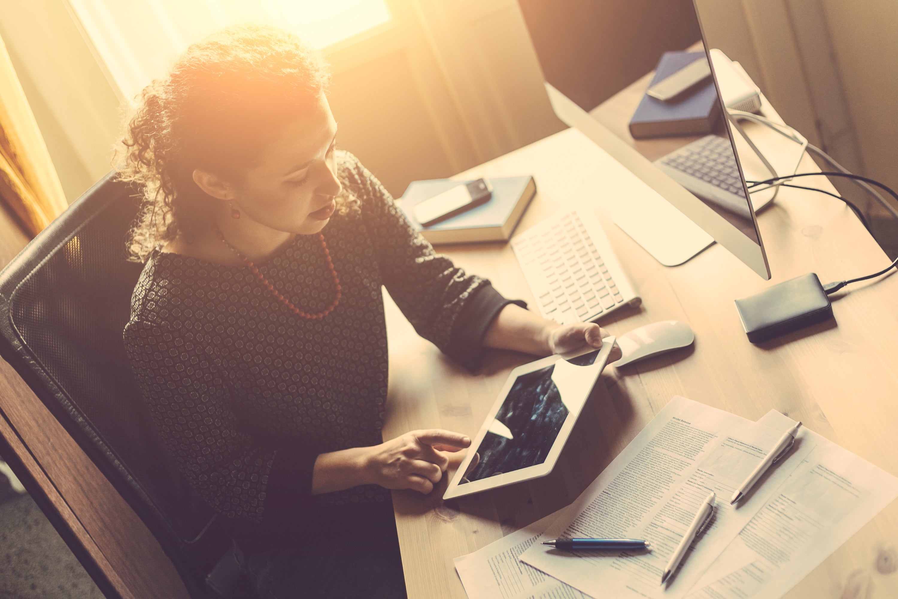 Woman checks account on multiple devices
