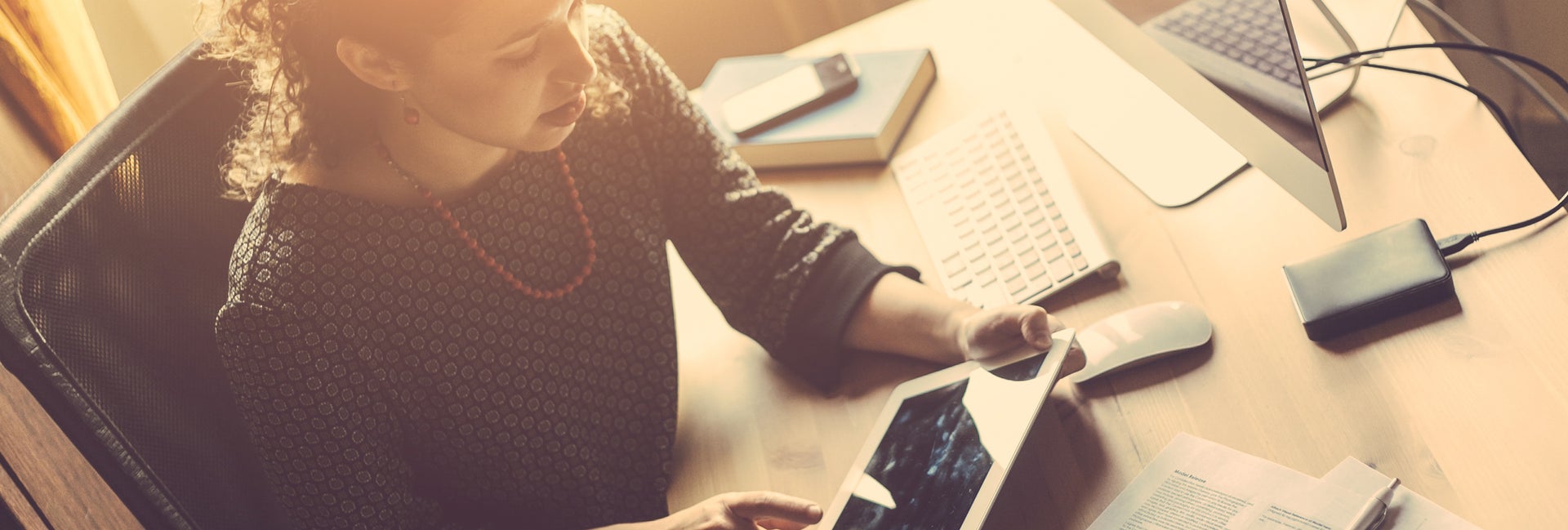 Woman checks account on multiple devices
