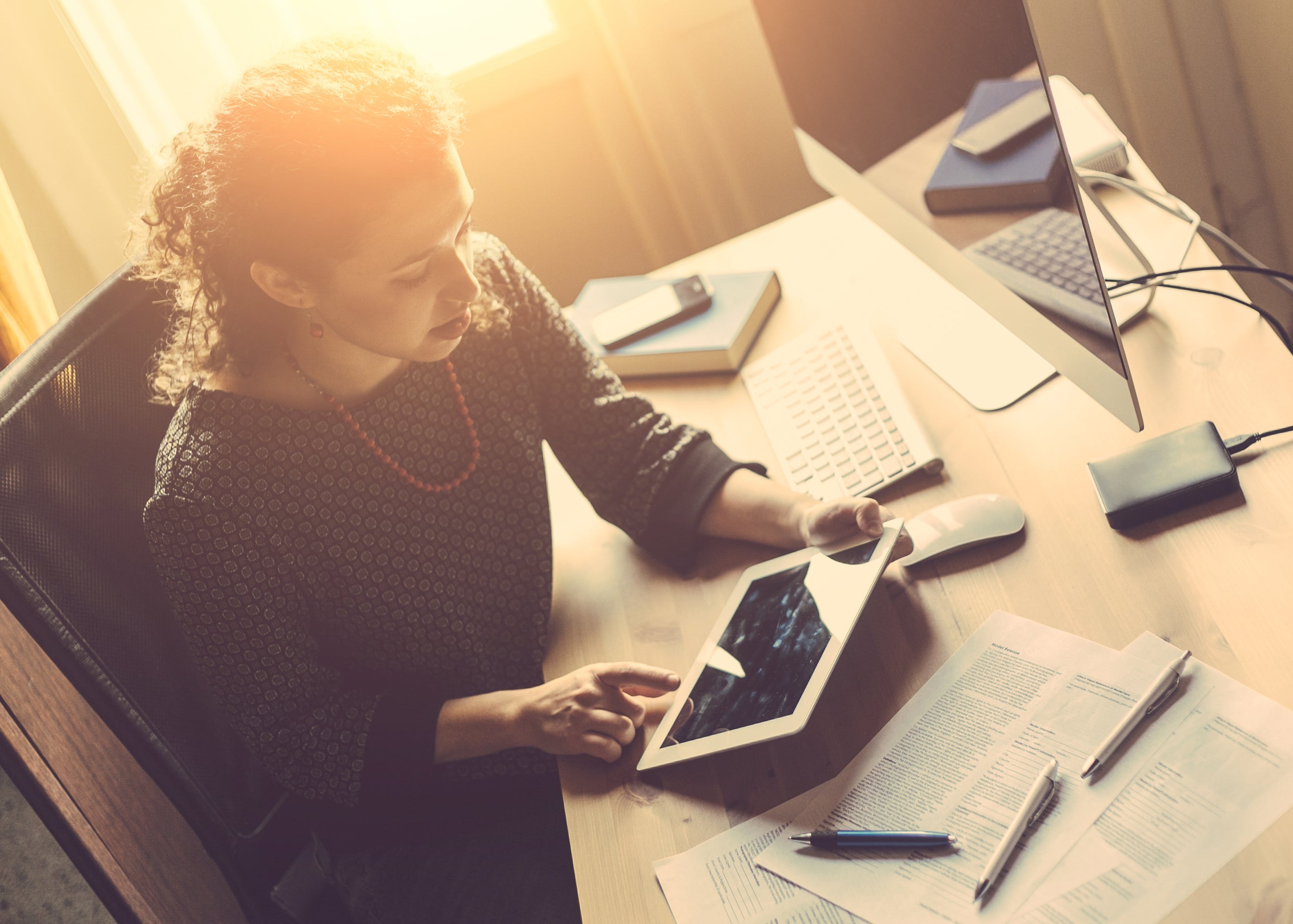 Woman checks account on multiple devices
