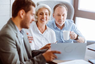 Three people in a financial planning meeting