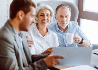 Three people in a financial planning meeting