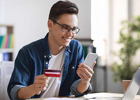 Man looking at checking account.