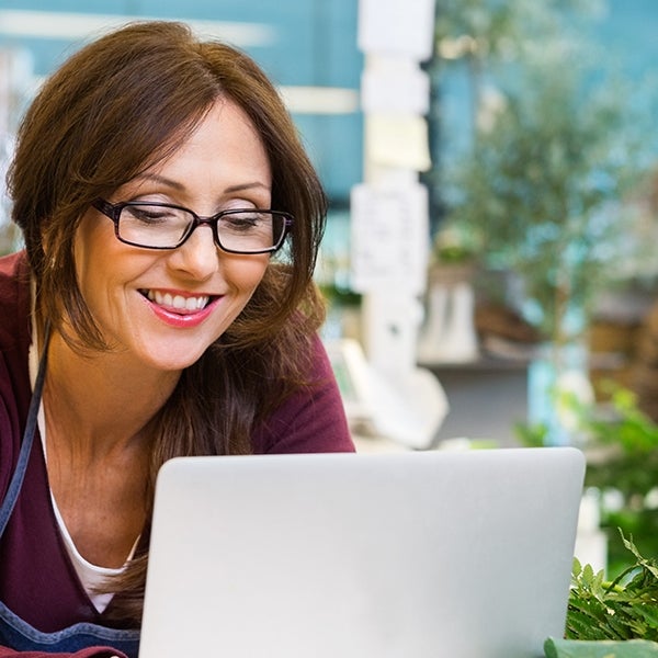 Business owner pays bills on computer