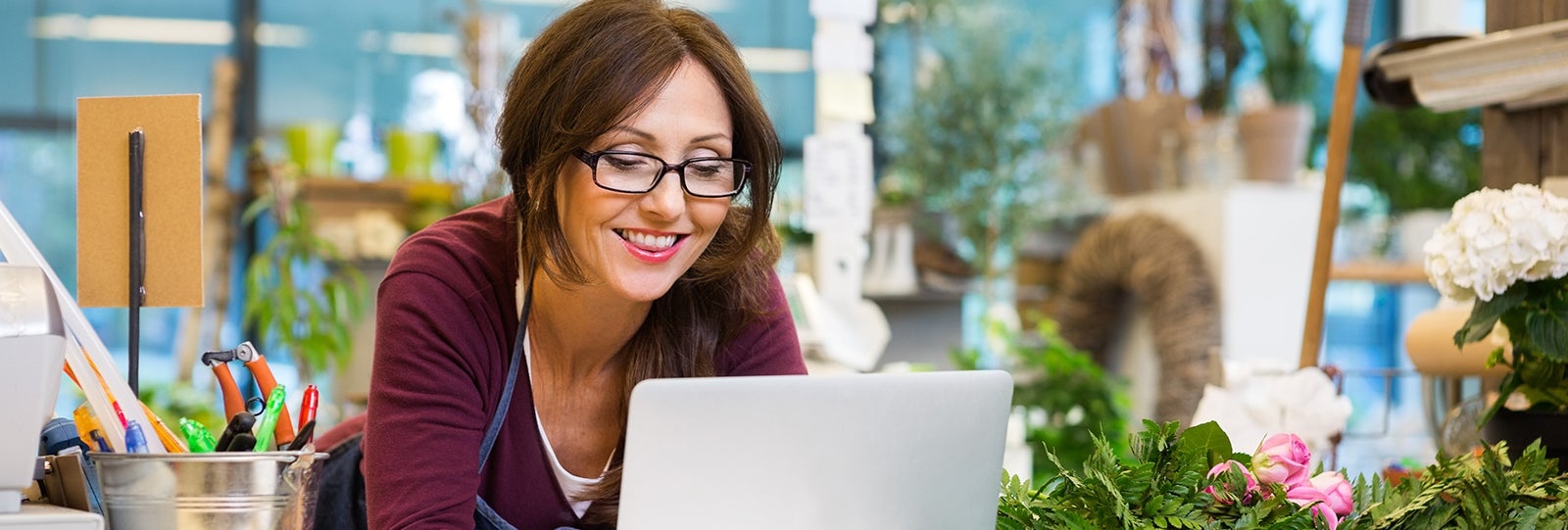 Business owner pays bills on computer