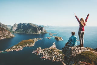 Man and woman celebrate after hiking