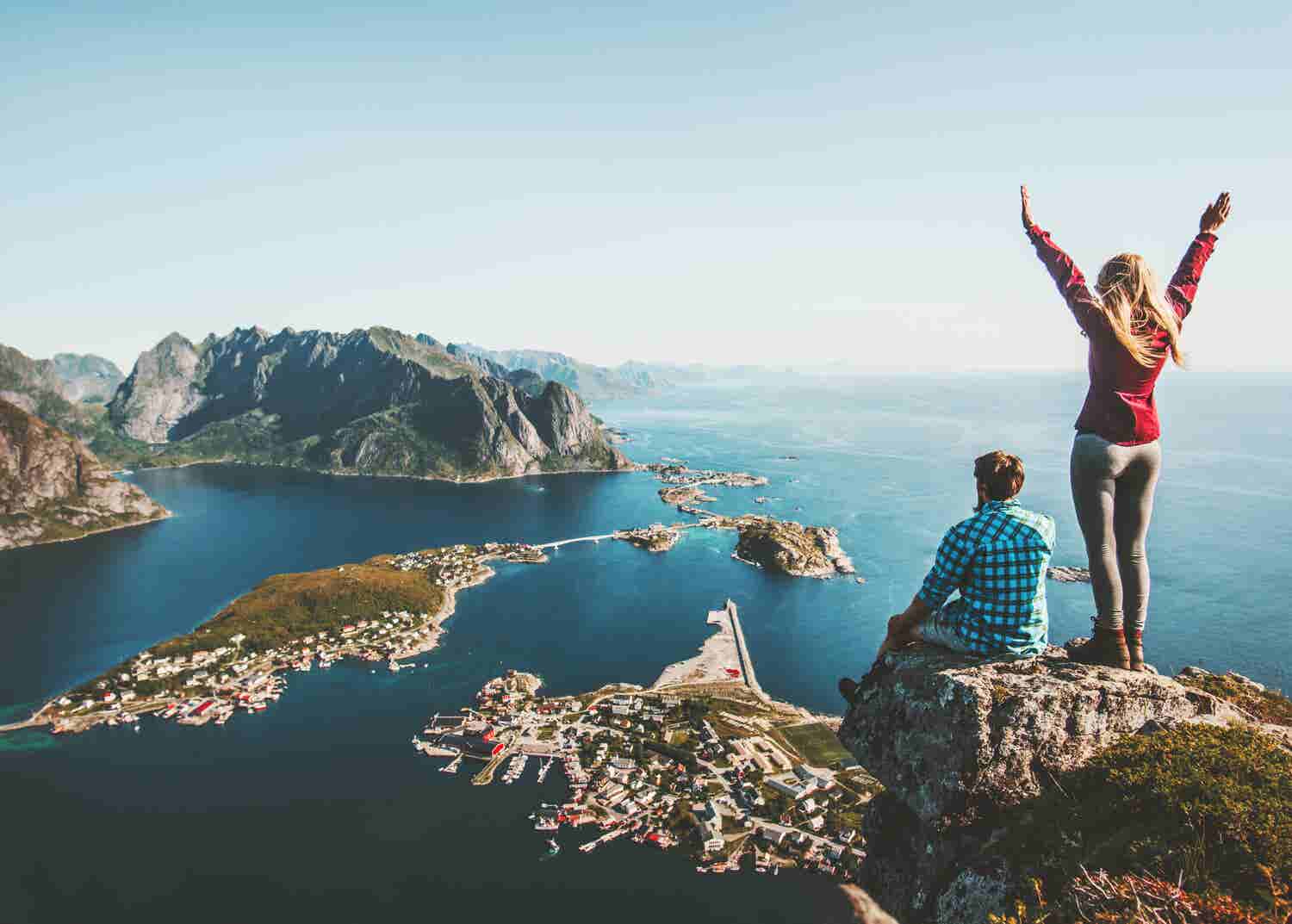 Man and woman celebrate after hiking