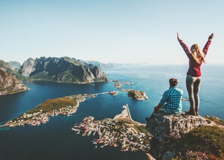 Man and woman celebrate after hiking