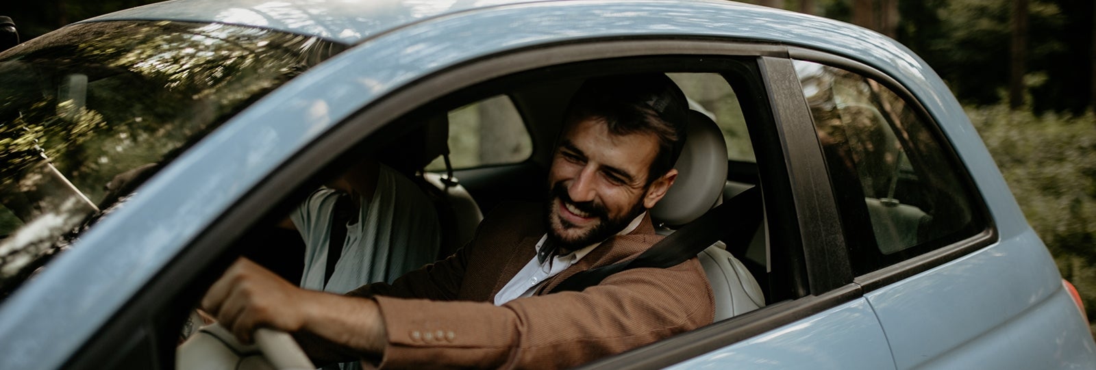Happy customer drives new car