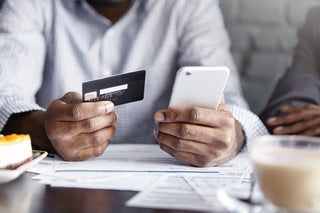 Man makes mobile payment using credit card