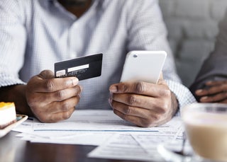 Man makes mobile payment using credit card