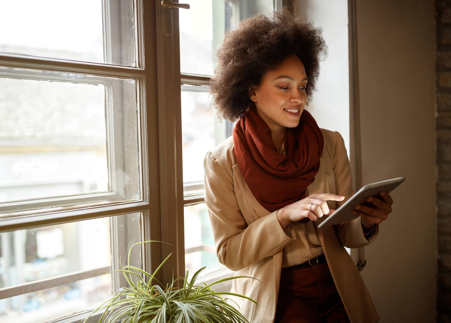 Lady on tablet wearing scarf