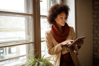 Lady on tablet wearing scarf