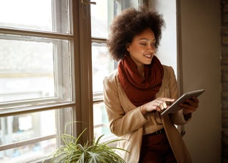 Lady on tablet wearing scarf