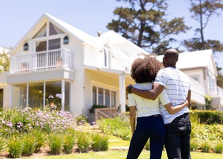 Couple admires new house