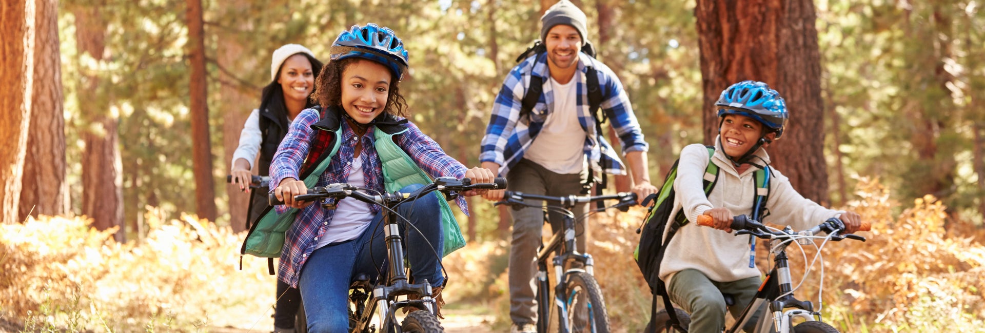 Family rides bikes together