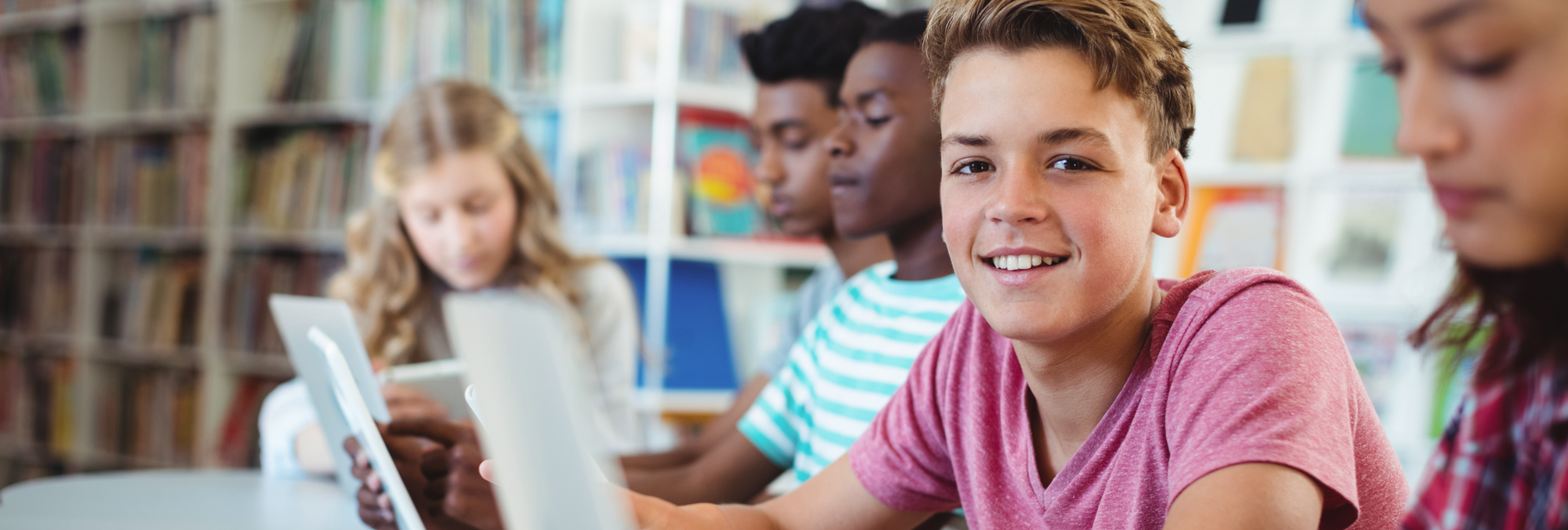 Students use laptops in school library