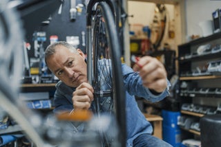 Man working on bike tire