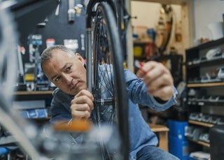 Man working on bike tire