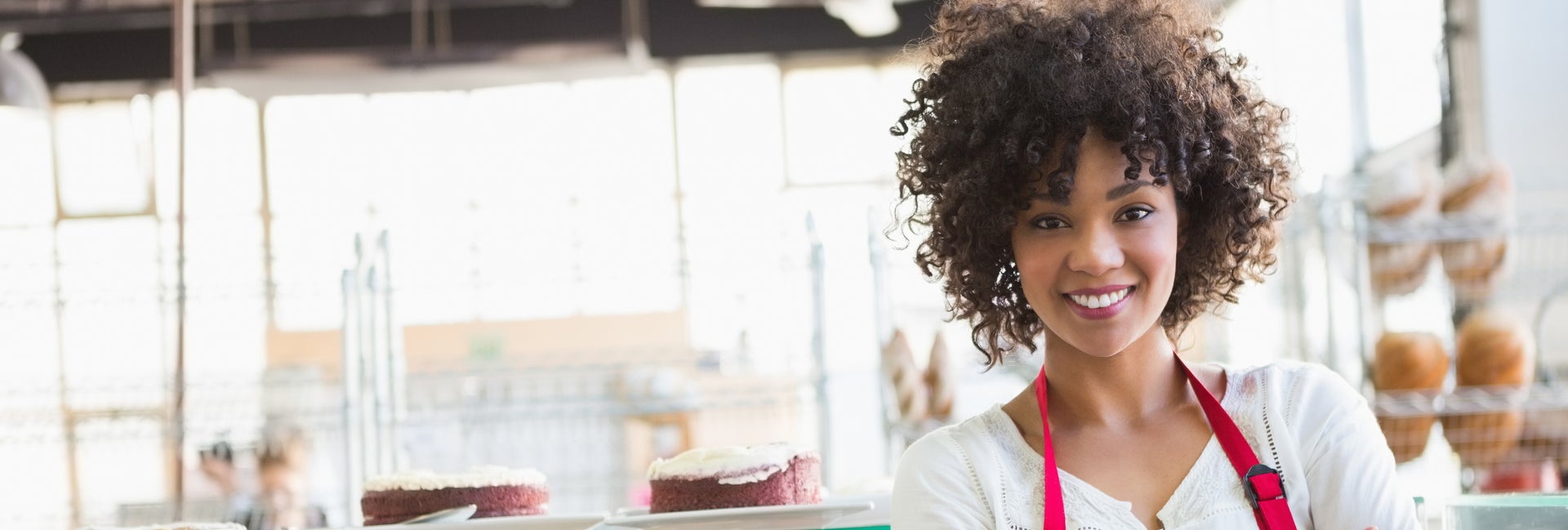 Business owner of bakery in apron