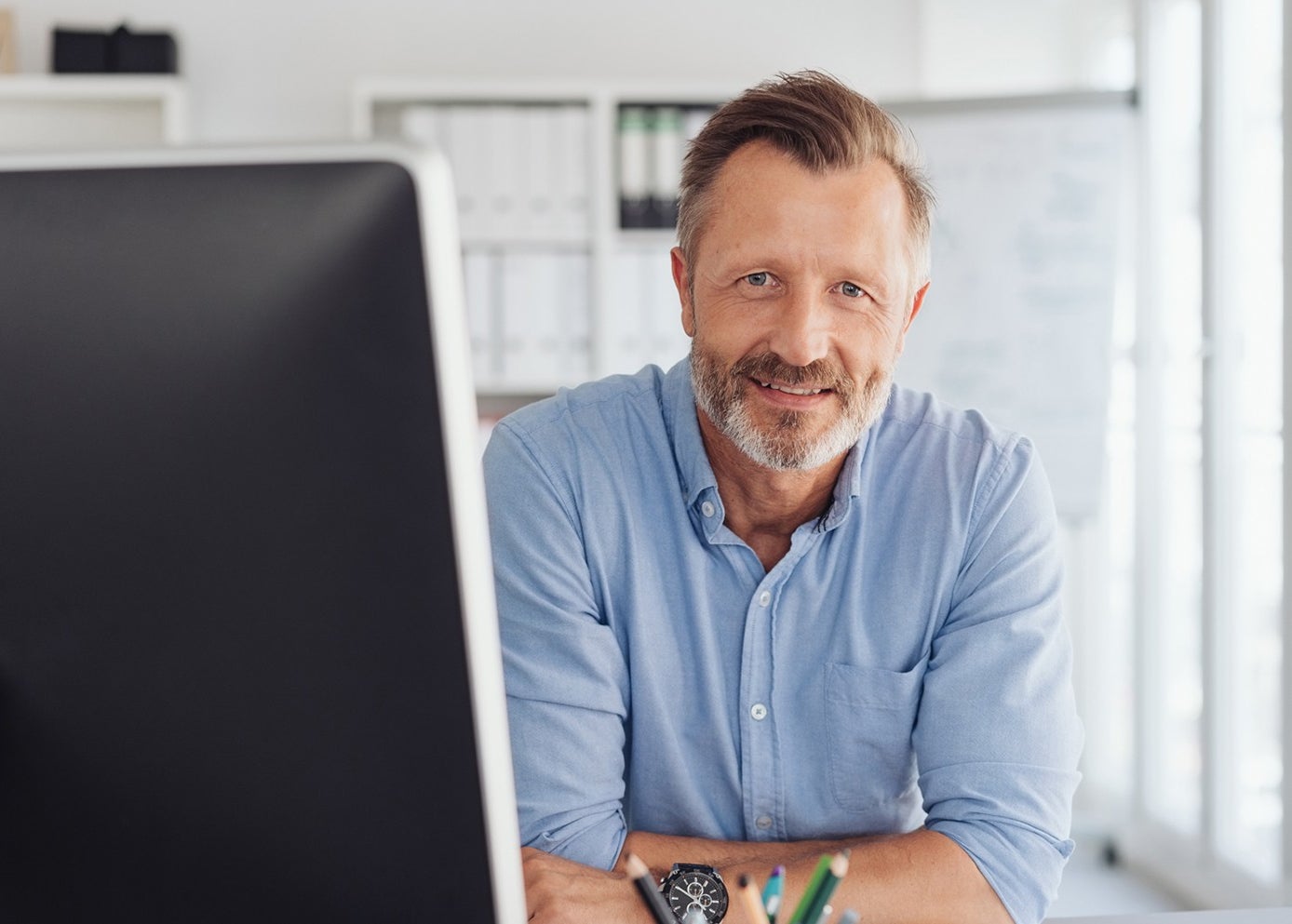 Man smiling in office