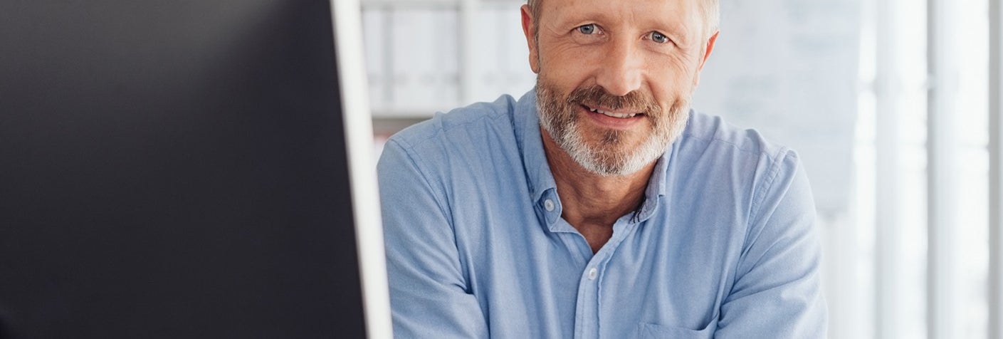 Man smiling in office