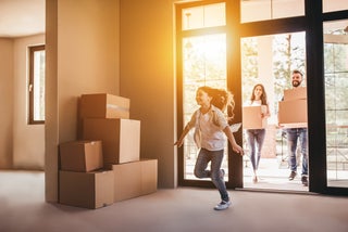 Family moves into new house with boxes