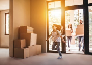 Family moves into new house with boxes