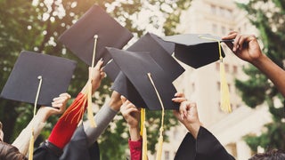 Graduations caps held up in the air