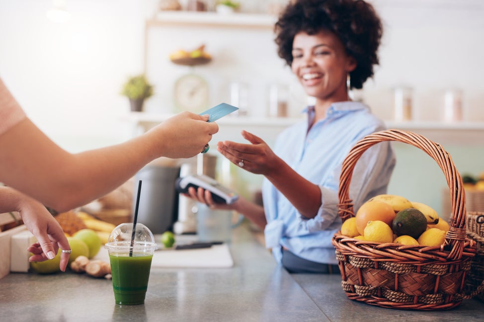 Customer pays for green juice with card