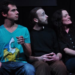 Michal, Vaněk, and Věra admire the newly furnished room.