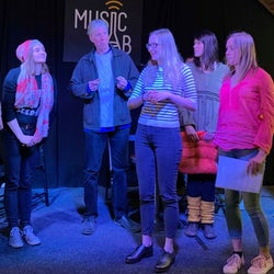 Actors practicing a song.