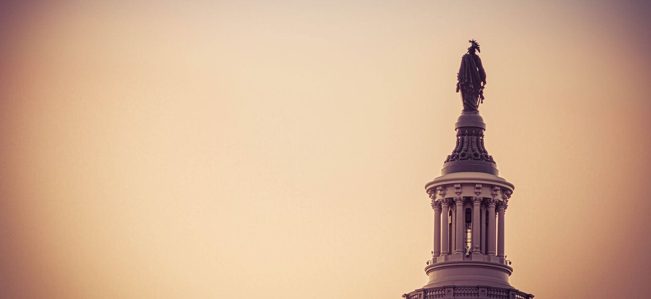 The statue of freedom on the top of the dome of the U.S. Capitol in the morning light.