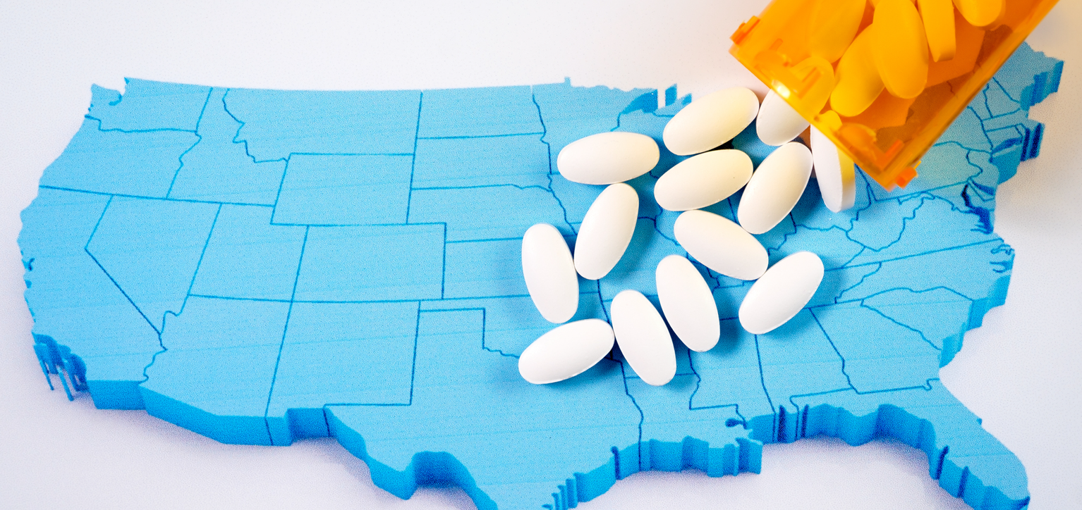 Opioids coming out of prescription pill bottle on map of the United States
