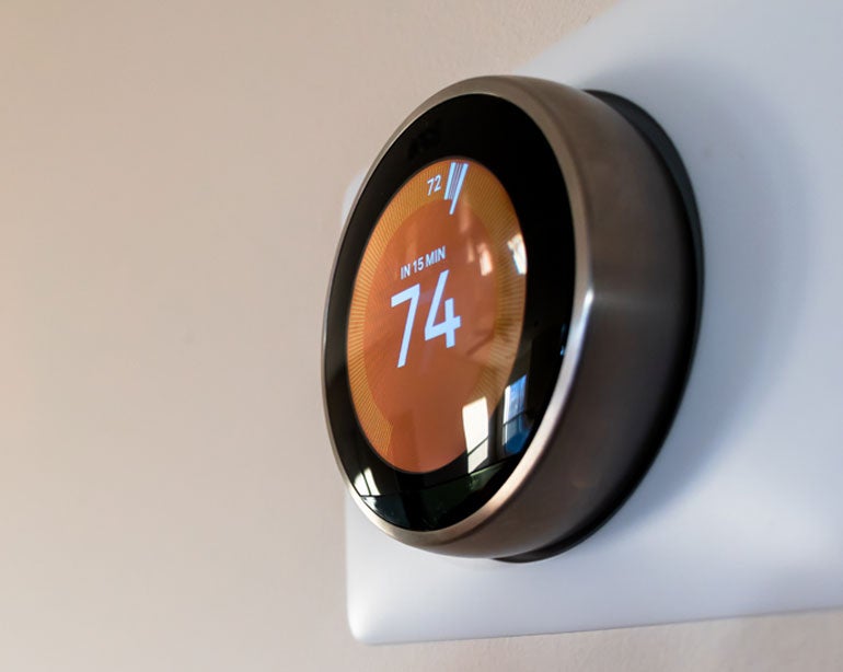 Close up shot of a smart home thermostat.