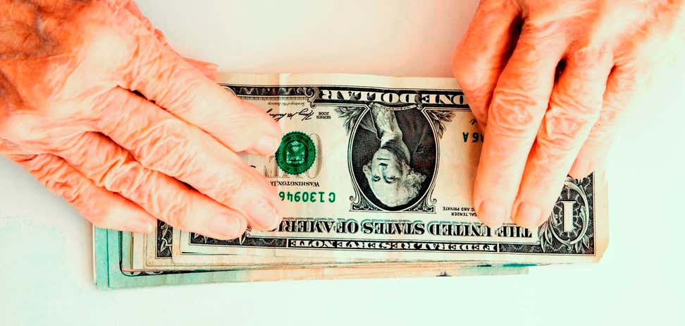 Elderly hands with money