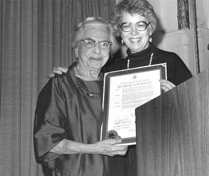 Ollie Randall, an NCOA founder and leader in the field of aging, is holding an award for her singular and outstanding contributions toward advancing the cause of aging.