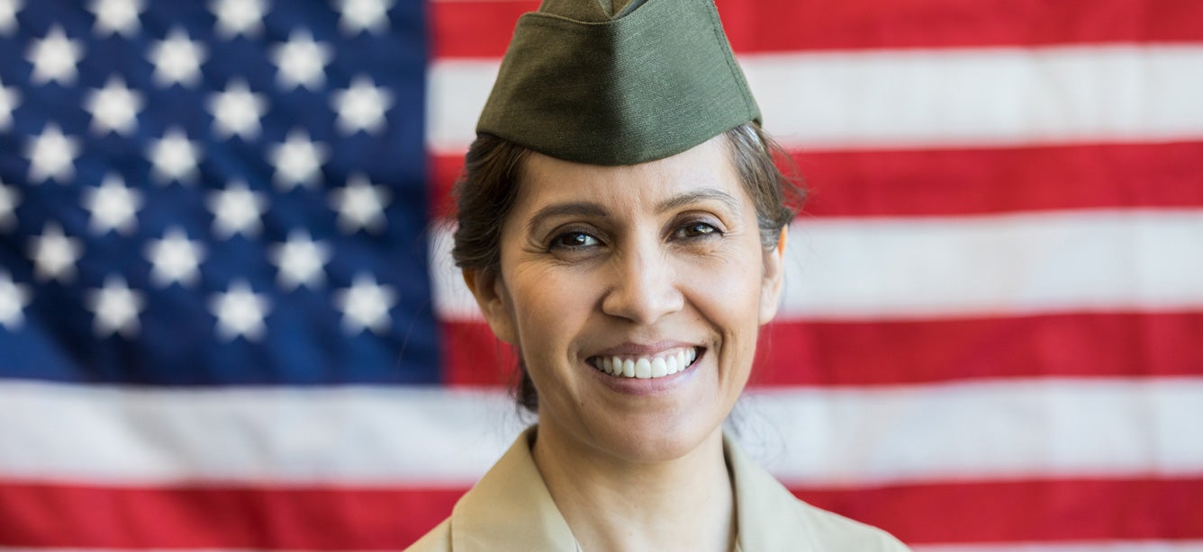 A close up, portrait of a Hispanic female U.S. Veteran.